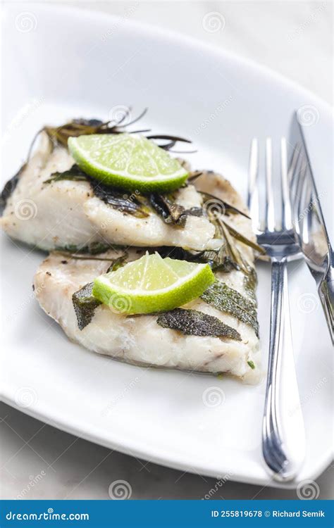 White Fish Fillet Baked with Herbs Stock Photo - Image of cooked ...