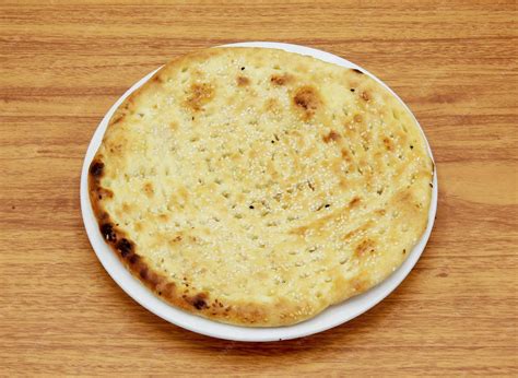 Premium Photo | Roghni naan or nan nun roti tandoori chapati pita bread ...