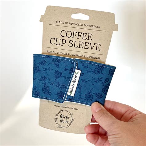 This reusable coffee cup sleeve is designed to fit standard disposable ...
