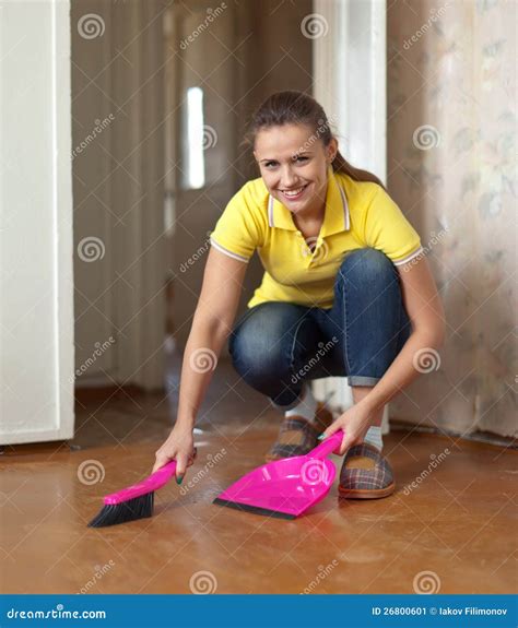 Woman sweeping the floor stock image. Image of house - 26800601