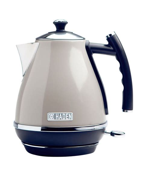 an electric kettle with the lid open and handle on it