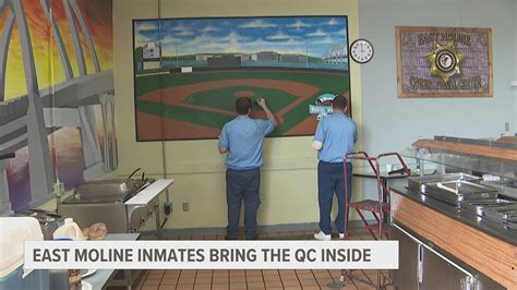 Inmates at East Moline Correctional Center paint mural of Quad Cities ...