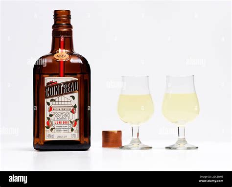 In this photo illustration, a Cointreau Liqueur bottle and glasses are ...