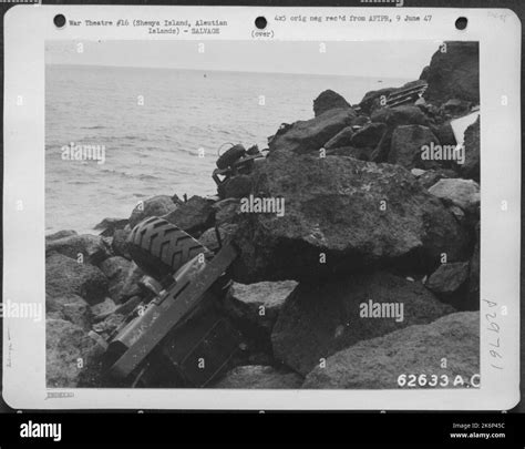 Surplus vehicles which have been pushed into the sea at Shemya Island ...