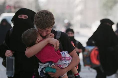 Syria: Manbij women burn burqas to celebrate freedom from Isis ...