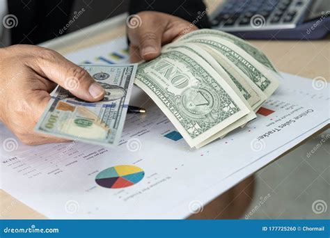 Asian Accountant Holding Dollar Banknotes, Working, Calculate and Analyzing Report Project ...