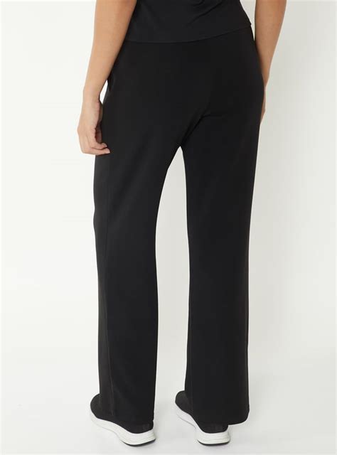 Buy Women Solid Wide Leg Track Pants Online at just Rs. 1099.0 ...