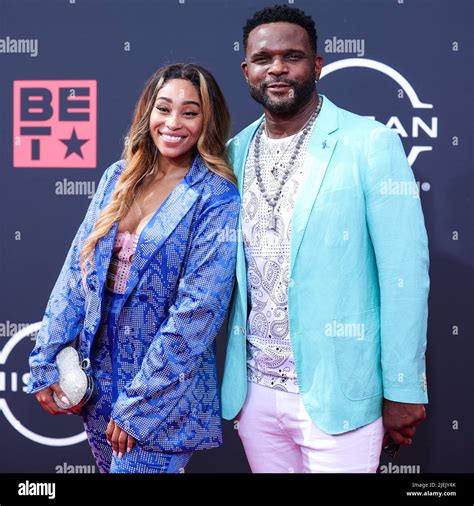 LOS ANGELES, CALIFORNIA, USA - JUNE 26: Sidney Starr and Darius McCrary arrive at the BET Awards ...