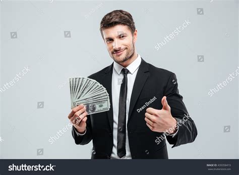 Guy Holding Money 的图像结果