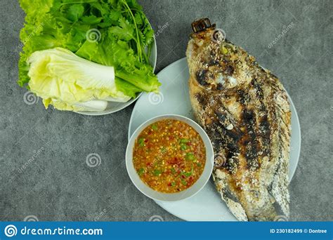 Salt-Crusted Grilled Fish Served with Fresh Vegetable and Dipping Sauce ...