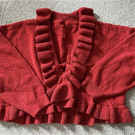A red and super cute cardigan! Only wore once and in... - Depop