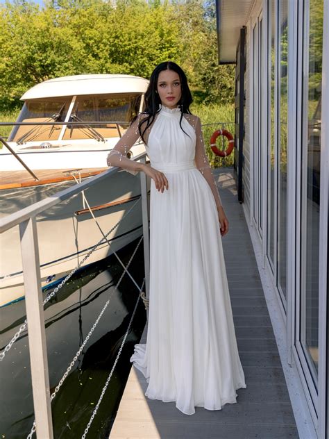 Halter neck sheath wedding dress with long sleeves and beads