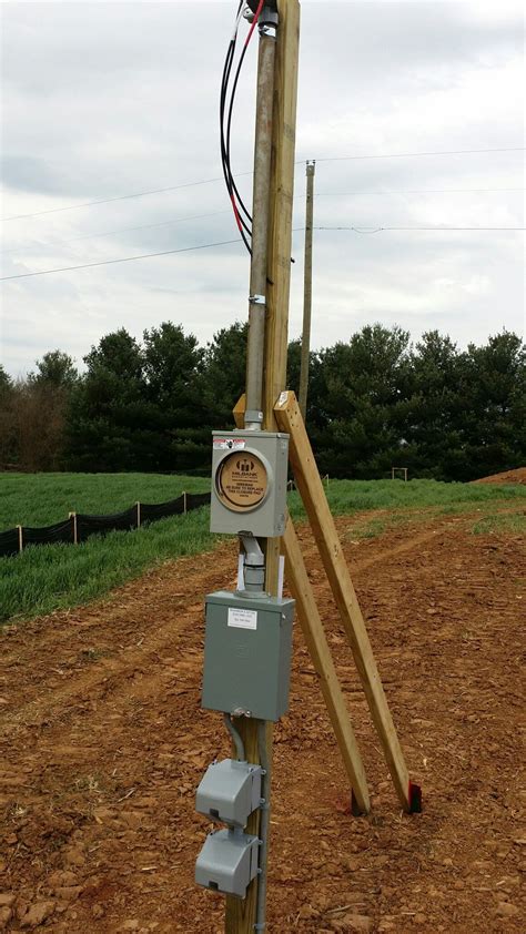 Temporary Pole with Electrical Device in Middle of Field