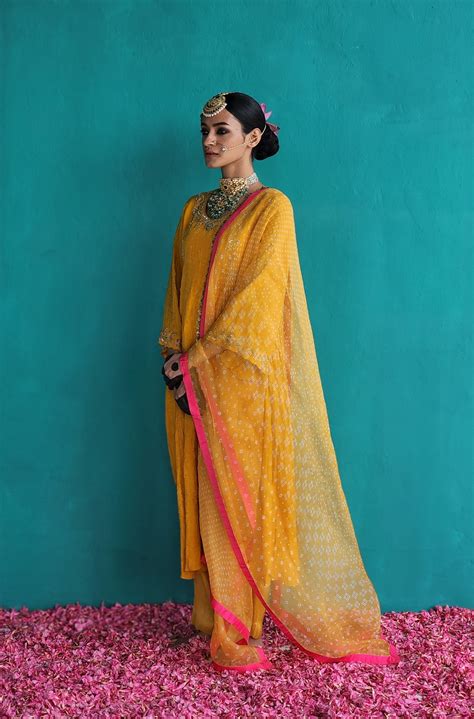 Warm- Hued Mango Yellow side panel kurta with Tissue pants & Dupatta ...