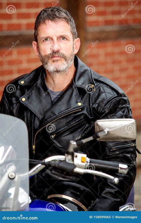 Biker Dressed in Black Leather Sitting on His Bike Stock Image - Image ...