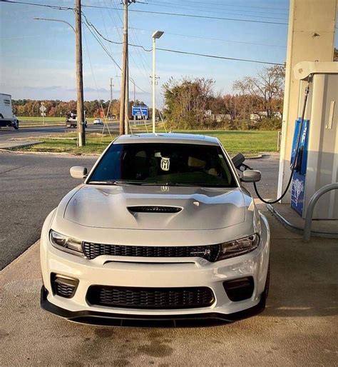 White Dodge Charger at Gas Station