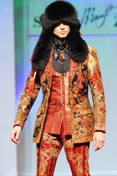 A model displays a creation by Russian designer Slava Zaitsev during a ...