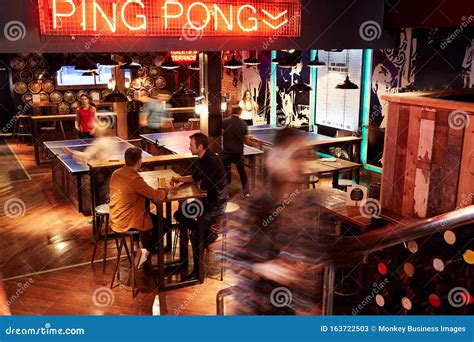 Interior of Bar with Customers Drinking and Playing Table Tennis Stock ...