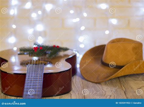Country Music Christmas with Guitar and Cowboy Hat Stock Image - Image ...