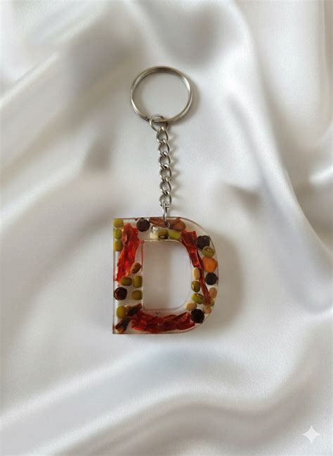 Alpha Key Chains & Hand Bag Accessories - Designer – Saffron Blossoms