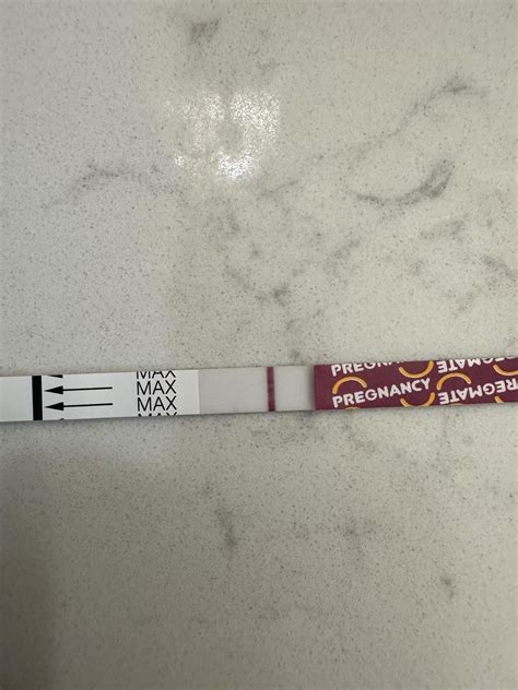 Pregmate test, 10 dpo. It looks like some of the dye caught on the ...