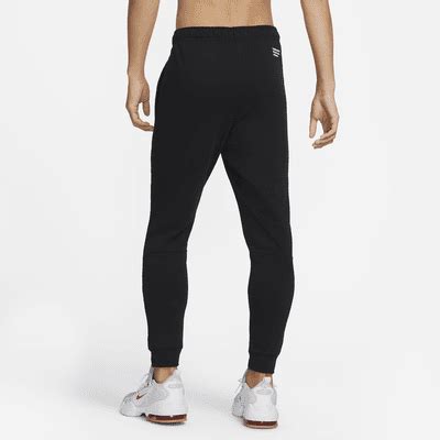 Nike Dri-FIT Men's Tapered Fitness Trousers. Nike IN