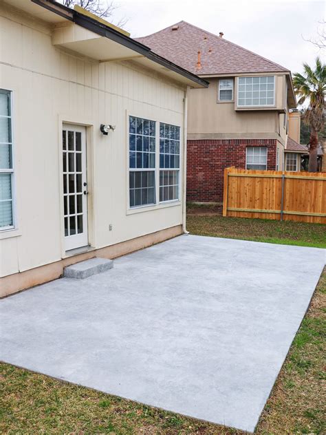 Resurfacing a concrete patio for a budget DIY patio makeover - Fab Everyday