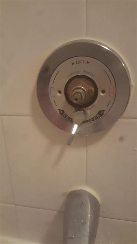 Water leaking out from bottom of shower knob, only when turned on. Help?? : r/Plumbing