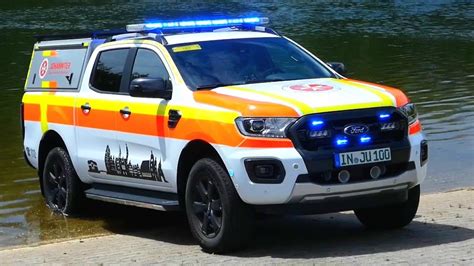 Emergency vehicles from the aid organization "Die Johanniter" pick up residents of a retirement home in Berlin, Germany, Saturday, Jan. 3, 2025, during a power cut in south-west Berlin after a fire on a cable bridge. (Michael Ukas/dpa via AP)