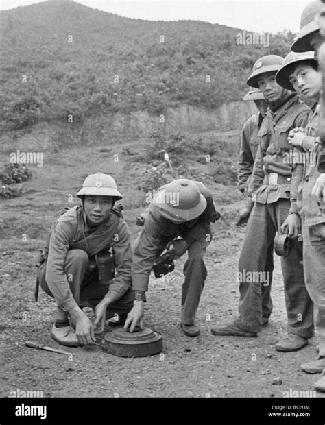 Vietnamese sappers neutralize an anti tank mine laid by Chinese ...