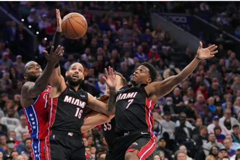 the miami heat logo is shown on a red background with white lettering ...