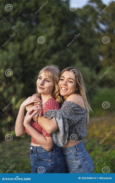 Vertical Shot of Two Beautiful Spanish Caucasian Friends Hugging ...
