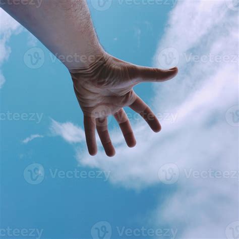 hand up reaching the blue sky 2586322 Stock Photo at Vecteezy