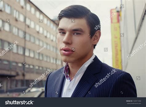 Man in a Business Suit in a Mall Parking Lot 的图像结果
