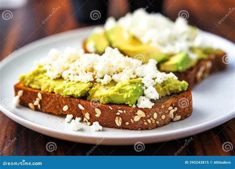Open-face Sandwich with Sliced Avocado and Crumbled Feta on Toast Stock ...