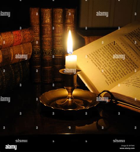 Old Open Book With Candle