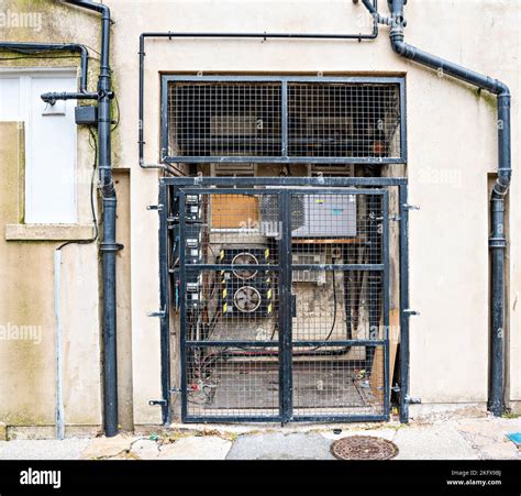 Air-Conditioning Units behind mesh grille Stock Photo - Alamy