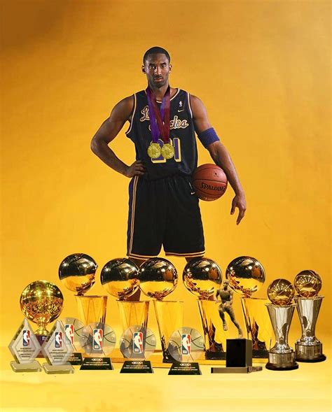 Kobe Bryant Holding Trophies
