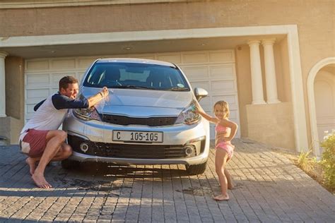 Father washing car with kid by home for learning bonding and child ...