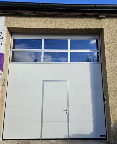 The installation of four Normstahl OSP42A industrial sectional overhead ...
