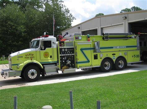Green Fire Truck Parked in Front of Building