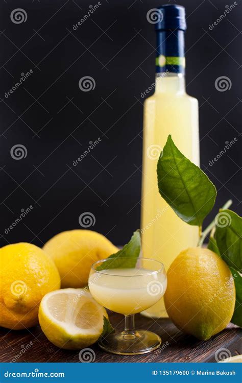 Limoncello in a Bottle and a Small Shot with Liquor. the Traditional ...