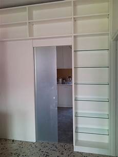 libreria con porta scorrevole arredamento su misura roncoroni legno libreria con porta scorrevole arredamento su misura roncoroni legno