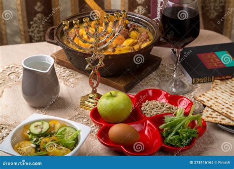 A Set Table for the Passover Seder with Traditional Matzah, Wine, Maror ...