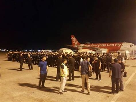 菲律宾将78名台湾籍诈骗疑犯移交大陆 被押上天津航空包机_航空要闻_资讯_航空圈