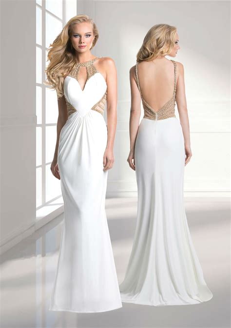 Beautiful low-back white floor length gown with gold jewels decorating ...