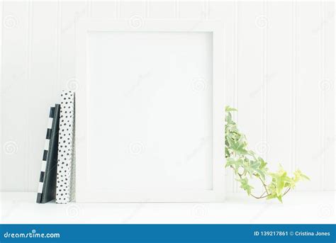 8x10 White Frame Mockup with Black and White Notebooks and Ivy Stock ...