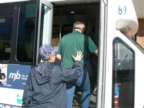 helping-client-on-bus | Geauga County Clerk of Courts