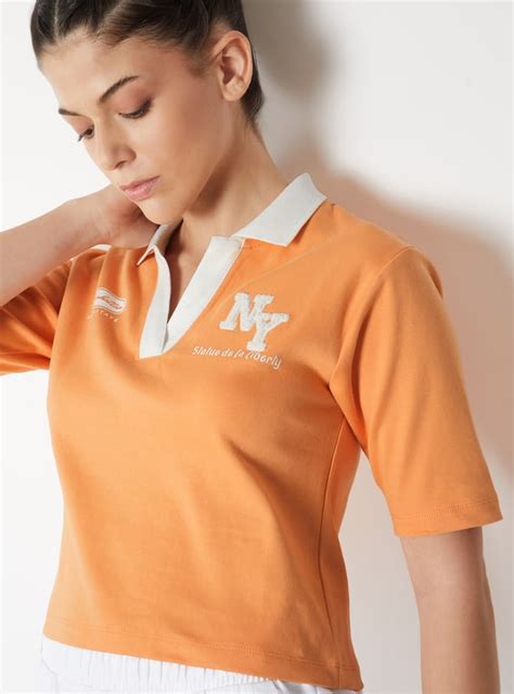 Buy Women Johnny Collar Sports T-shirt Online at just Rs. 599.0 ...
