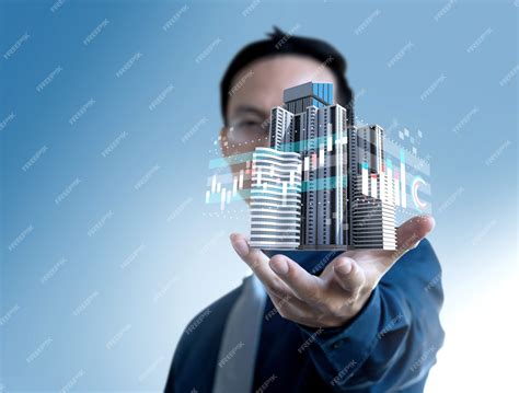 Businessman show graph value price of real estate building for ...